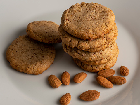 Home baked cookies and glass of milk on a kitchen table. Home cooked concept. Sill life food photography.