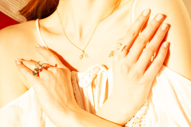 Beautiful gold jewelry on a girl close-up.