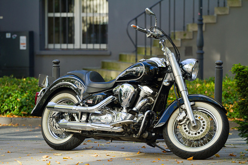 Leiria, Portugal – October 16, 2022: A beautiful chrome Harley Davidson motorcycle parked on display on a road