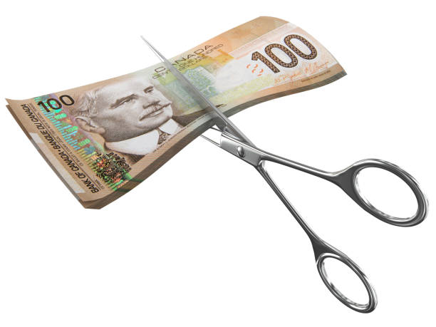 canadian money cut scissors crisis - cheap finance cutting downsizing imagens e fotografias de stock