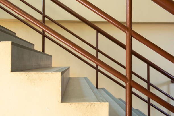 istock Front view  Concrete Stairs Brown Handrails Indoor Staircase Modern Building Staircase Empty 1311942234