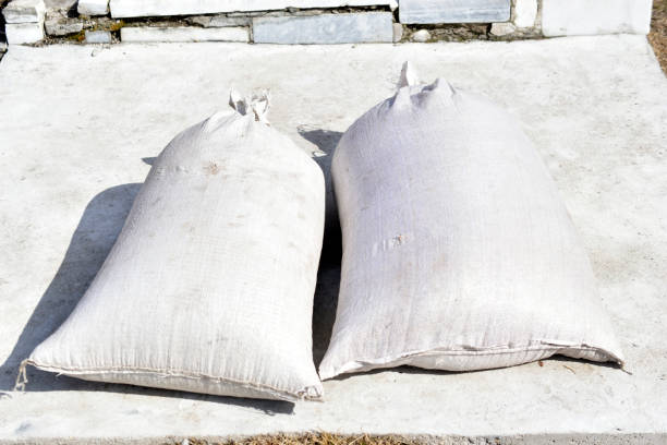 istock Two full sacks of grain on the ground in the yard 1311943429