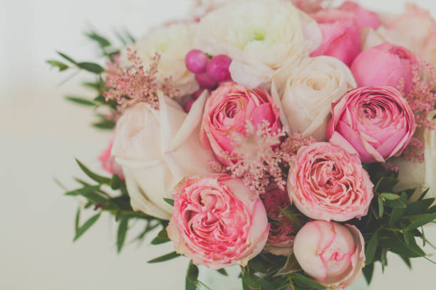 istock Roses and ranunculus flowers bouquet close up 1311945516