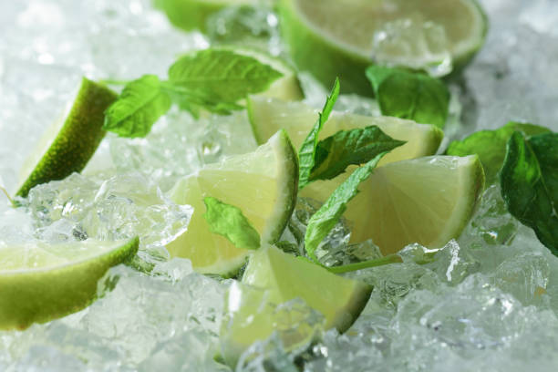 istock Lime slices with mint and ice. 1311946605