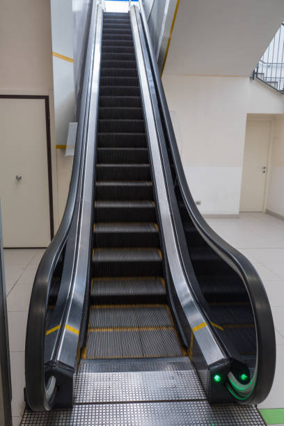 istock Long Black Escalator on the Move in a Public Space 1311946781