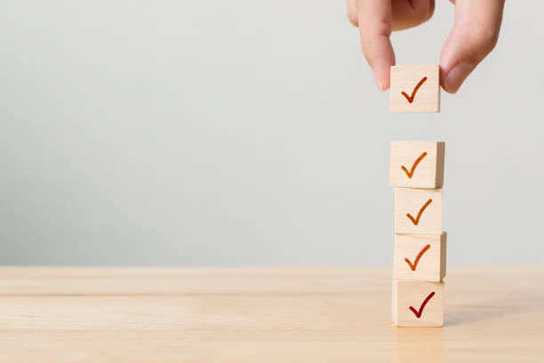 istock Checklist concept, Check mark on wooden blocks on table with copy space 1311947665
