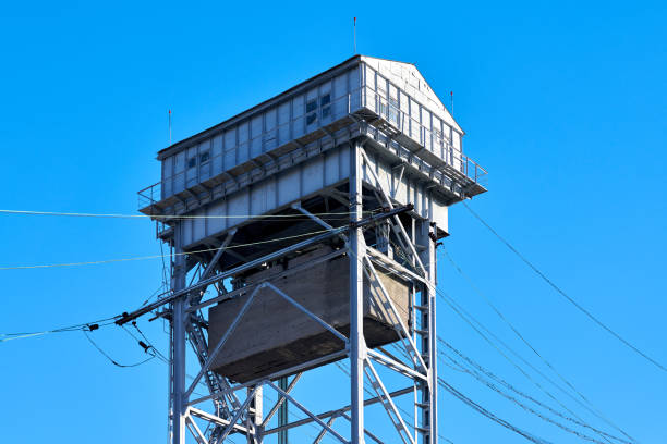 Two-tier vertical lift bridge with railways car road