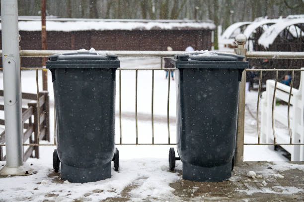 istock Grey garbage bins, trash containers outdoors in winter 1311949457