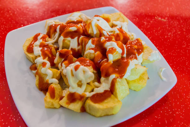 istock Patatas bravas, potatoes with a hot sauce, popular tapas dish in Spa 1311951223