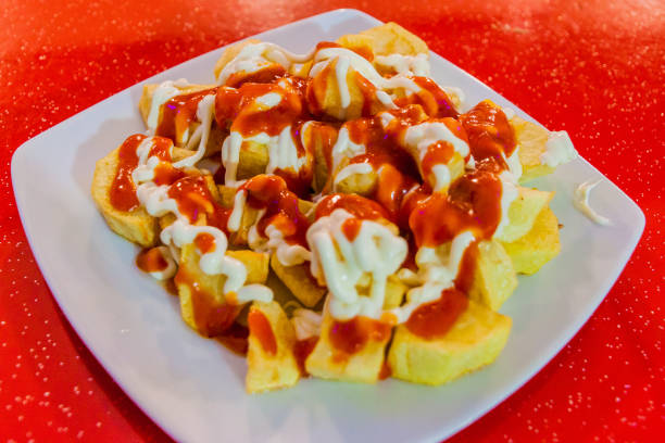 istock Patatas bravas, potatoes with a hot sauce, popular tapas dish in Spa 1311951224