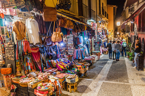 Granada, Spain - November 2, 2017: Various stalls in Calle Caldereria Nueva street in Granada.