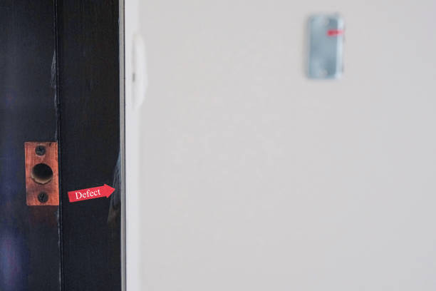 istock red sign tag for check defect wooden door frame construction new house. 1311953835