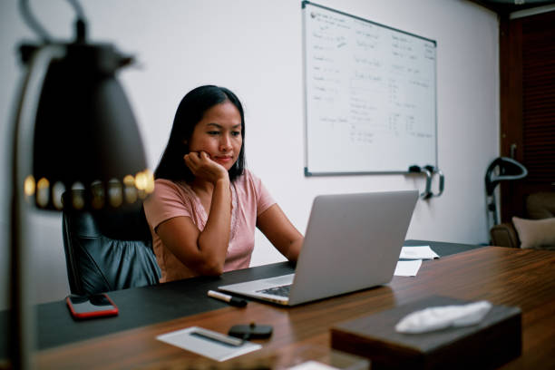 istock Young Beautiful Woman Working Using Laptop in Her Home Office 1311954225