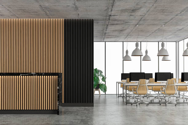 istock Empty office interior with copy space and wordesks and reception desk on concrete floor 1311954258
