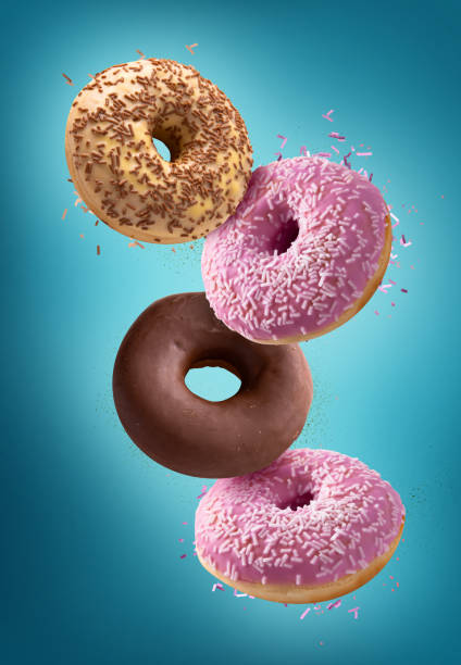 istock Various doughnuts isolated on colorful background 1311955398
