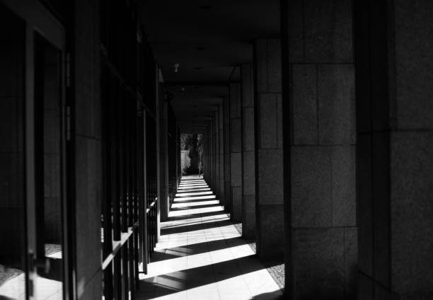 istock Dark corridor of a concrete building 1311957985