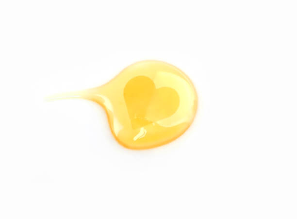 istock Drop of CBD oil Distillate with heart shape. 1311959529