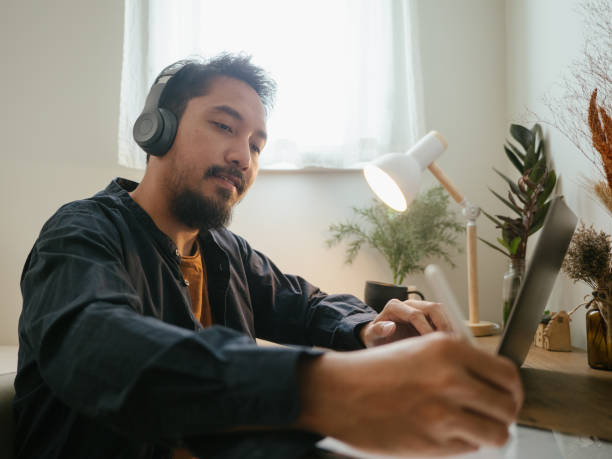 istock Hipster man working and busy at home. 1311961624