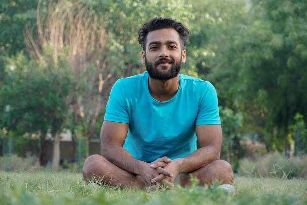 istock a man in park after yoga smiles 1311961693