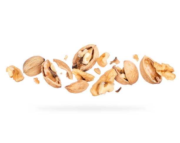 istock Crushed walnuts close-up hovered in white space 1311964841