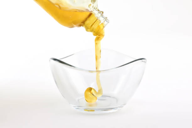 istock High quality CBD oil Distillate pouring into bowl. 1311966042