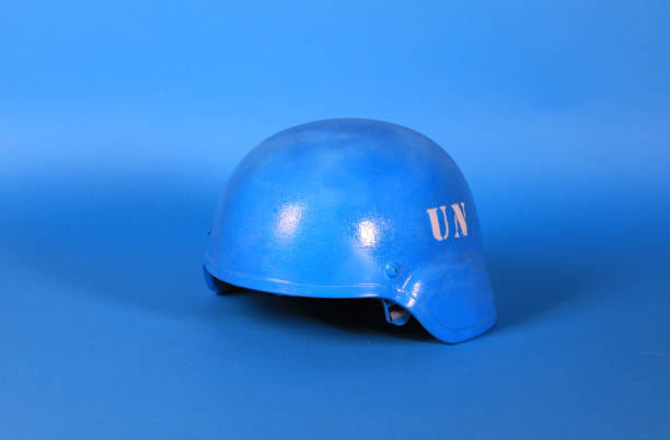 istock un blue helmet on blue background 1311968535