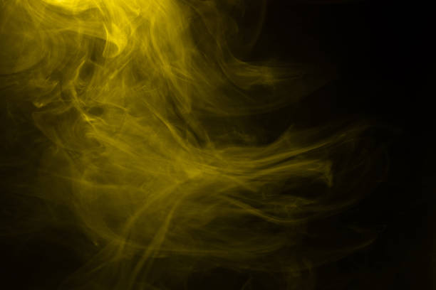 istock Yellow and pink steam on a black background. 1311969395