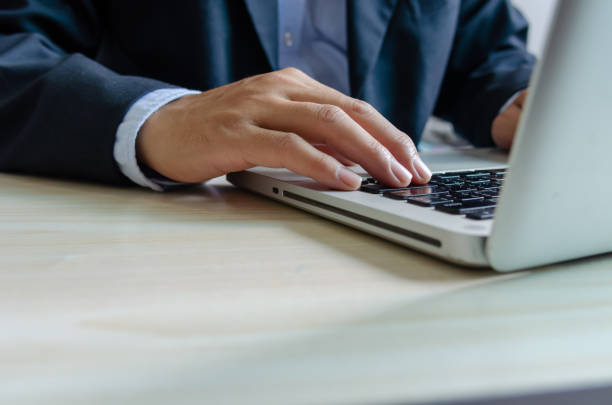 istock business man typing on keyboard computer laptop. 1311969977