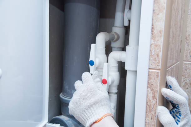 istock A plumber with a special tool repairs the equipment. 1311971070