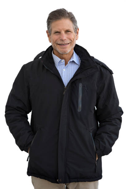 istock Man in jacket hands in pockets looking at camera smiling 1311972226