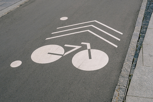 Bicycle lane. Drawn bike on the pavement. Sports and active lifestyle concept.