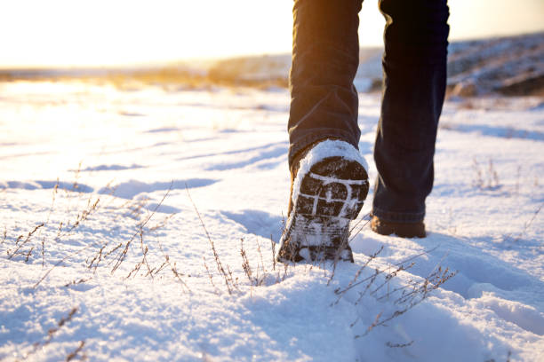 istock man walking in the snow 1311973466