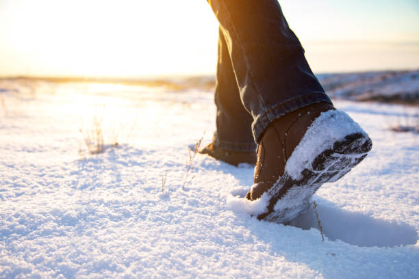 istock man walking in the snow 1311973508