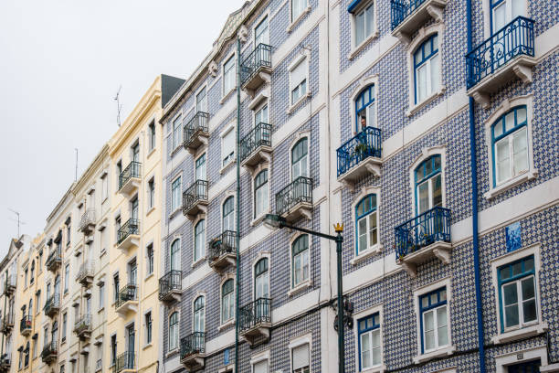 Details of the front  of old buildings with Portuguese tiles (Azulejo) in the Alfama district of Lisbon