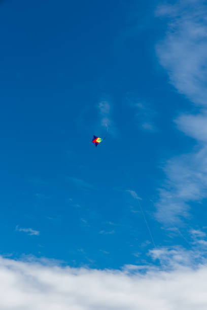 istock Colorful Kites flying over the sky 1311976651