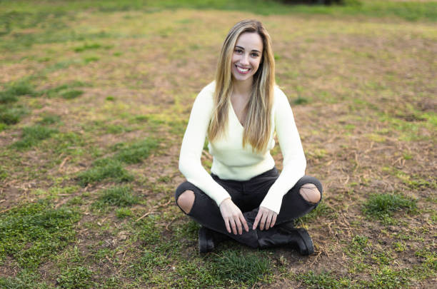 istock Beautiful young woman smiling 1311980409