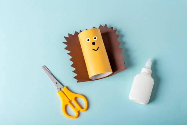 istock DIY and kids creativity. Step by step instruction: how to make hedgehog from toilet roll tube. Step3 finished craft with glued needles. Children Craft workshop. Eco-friendly reuse recycle. 1311981325