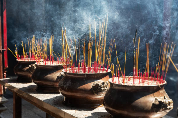 istock Burning red incense sticks in Chinese temple. 1311982694