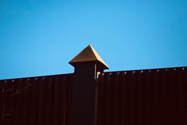 istock Metallic protection wall with sky background 1311984516