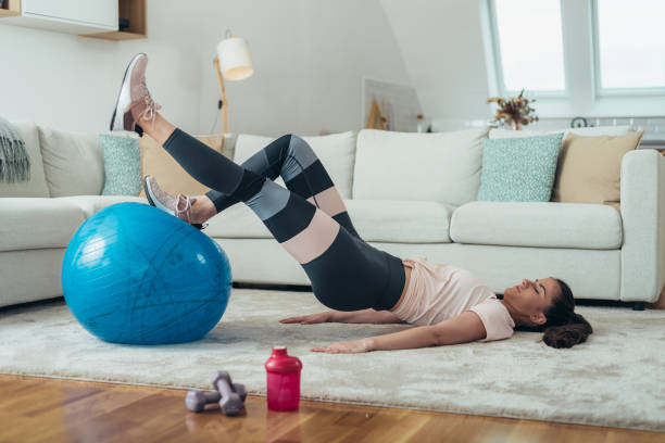 istock Woman training at home 1311985212