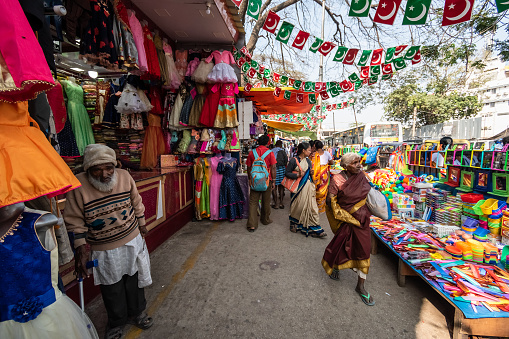 Bangalore, Karnataka, India - January 2019: A crowded market street with colorful stalls in the KR Market area of the city of Bengaluru.