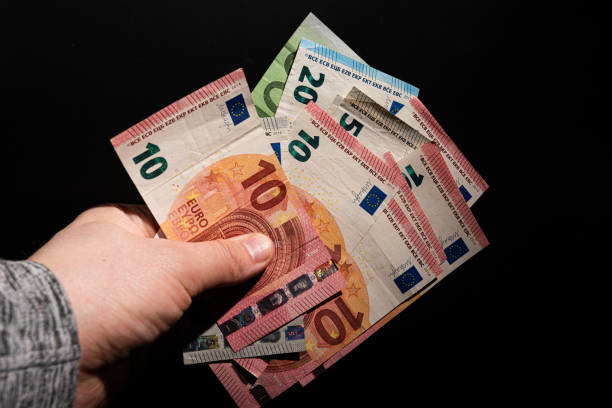 istock Hand holding different values of Euro banknotes.. 1311985413