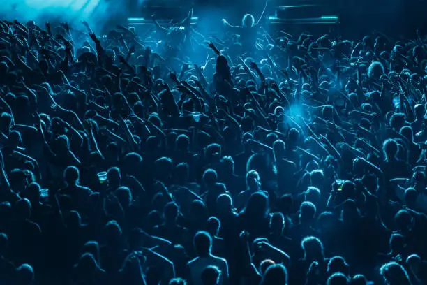 Photo of Concert crowd in front of stage lights
