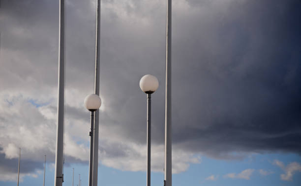 istock Traditional electric lamp posts with dark sky background 1311985908