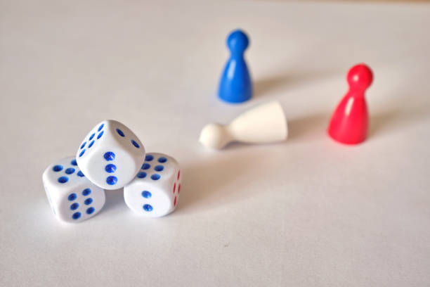 istock Colored game figures chips for board games. Collection of dice cubes on white background 1311987445