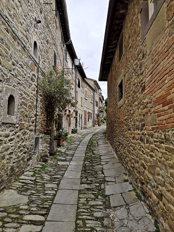 Narrow alley in the ancient town of Cortona, Arezzo province, Tuscany