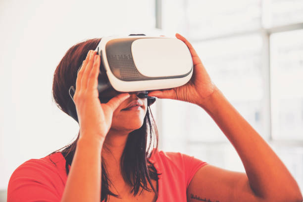 istock Girl Enjoying Virtual Reality Gaming at Home 1311988384