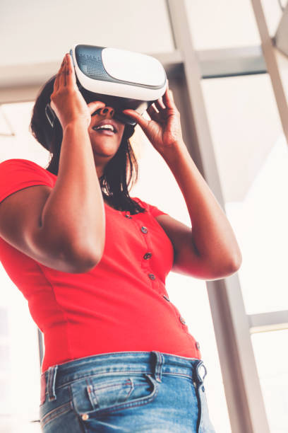 istock Girl Enjoying Virtual Reality Gaming at Home 1311988390