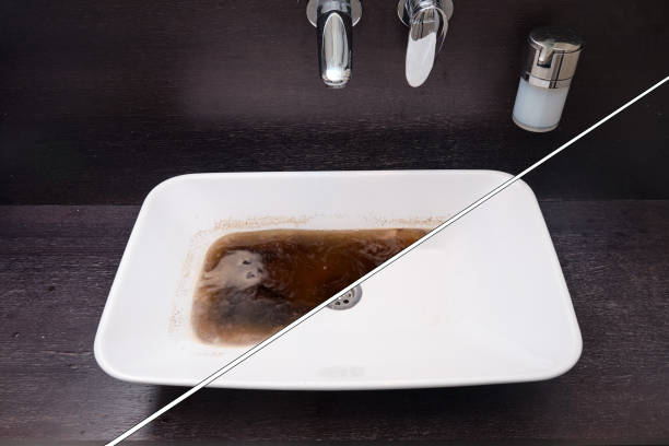 istock Unclog a bathroom sink. Before and after fixing the blockage problem 1311988680