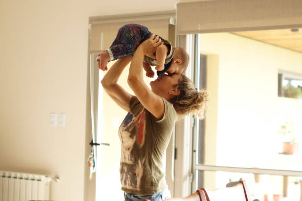 istock woman playing with her baby 1311989949